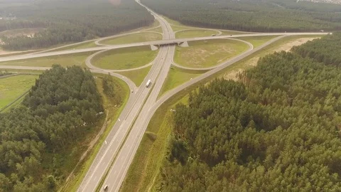 Aerial View. Flight over the road with cars near the forest. Aerial drone shot. Stock-Footage 78567286