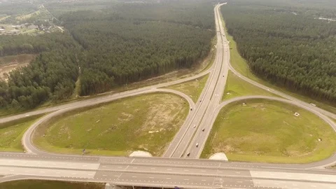 Aerial View. Flight over the road with cars near the forest. Aerial drone shot. Stock-Footage 78570689