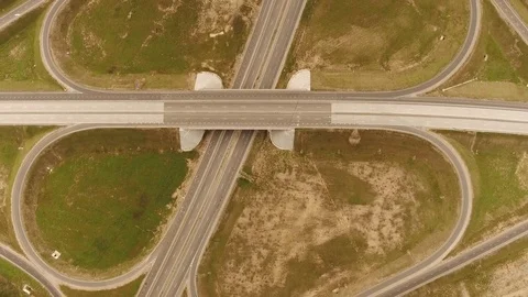 Aerial View. Flight over the road with cars near the forest. Aerial drone shot. Stock-Footage 78573764