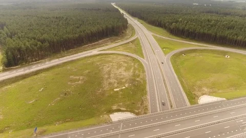 Aerial View. Flight over the road with cars near the forest. Aerial drone shot. Stock-Footage 78589345