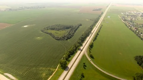 Aerial View. Flight over the road with cars near the fieldt. Aerial drone shot. Stock-Footage 78926654