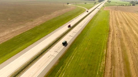 Aerial View. Flight over the road with cars near the fieldt. Aerial drone shot. Stock-Footage 78927862