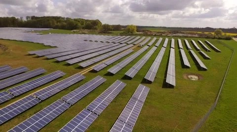 Aerial view  flight over solar panels modules on green meadow Stock Footage 62934312
