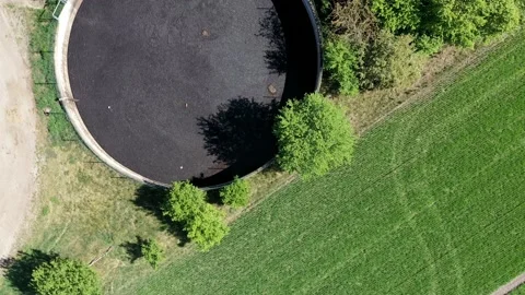 Aerial view of the flight over three huge slurry ponds for drying pig manure Stock Footage 130570757