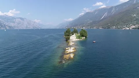 Aerial view flight over Trimelone Island is an islet of Lake Garda 4k Stock Footage 138430853