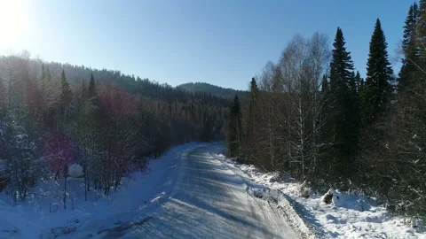 Aerial View. Flight over the Winter Mountain Road. Altai. Siberia Stock Footage 91370181