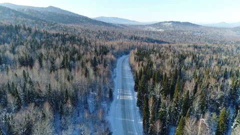 Aerial View. Flight over the Winter Mountain Road. Altai. Siberia Stock Footage 91370204