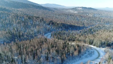 Aerial View. Flight over the Winter Mountain Road. Altai. Siberia Stock Footage 91370211