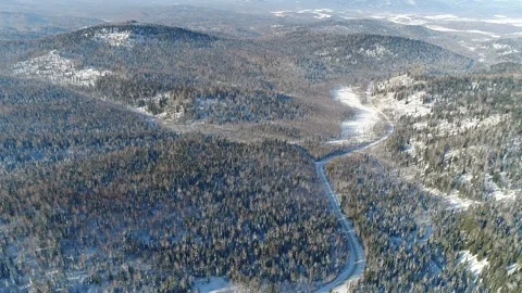 Aerial View. Flight over the Winter Mountain Road. Altai. Siberia Stock Footage 91370242