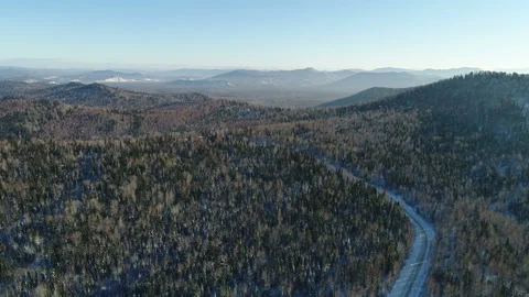 Aerial View. Flight over the Winter Mountain Road. Altai. Siberia 動画素材 91370284
