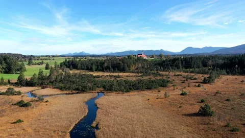 Aerial view, flight at  Reutberg Monasterywith Neuweiher, near Sachsenkam, Up Stock Footage 183247555
