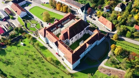 Aerial view, flight at  Schftlarn monastery, Isar valley, Upper Bavaria, Bava Stock Footage 181423554