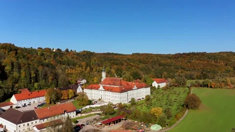 Aerial view, flight at  Schftlarn monastery, Isar valley, Upper Bavaria, Bava Stock Footage 181424168