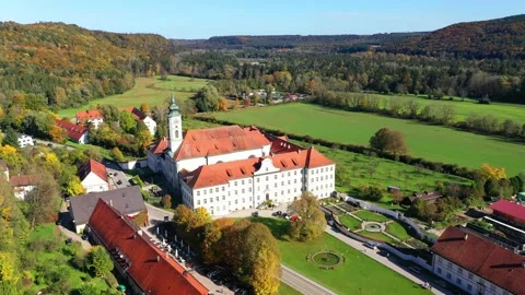 Aerial view, flight at  Schftlarn monastery, Isar valley, Upper Bavaria, Bava Stock Footage 181424199