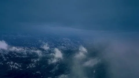 Aerial view. Flight through clouds in storm. Black clouds accompanied by Stock Footage 236363689