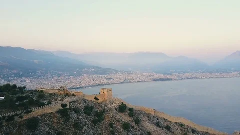 Aerial view. Flight thru the ancient castle on the hill to the cityscape with 스톡 동영상 77489966