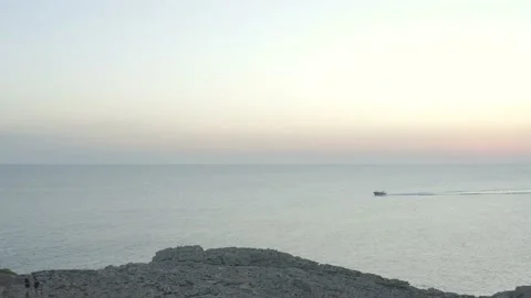 Aerial View Of Floating Boat During Sunset Stock Footage 136560090