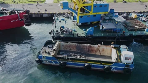 Aerial view floating crane at the pier, workers cleaning the barge Stock Footage 232475916