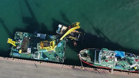 Aerial view floating crane at the pier, workers cleaning the barge Stock Footage 232476028
