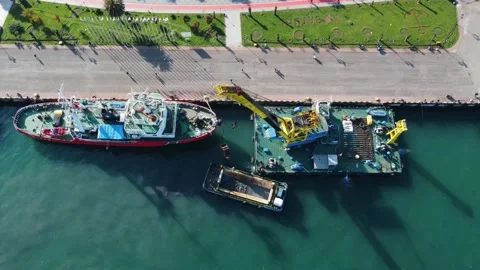 Aerial view floating crane at the pier, workers cleaning the barge Stock Footage 232476299