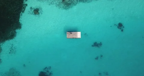 Aerial view of floating platform on turquoise sea Stock Footage 162055004