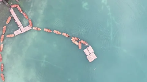 Aerial view of floating safety barriers in turquoise coastal water Stock Footage 345167042