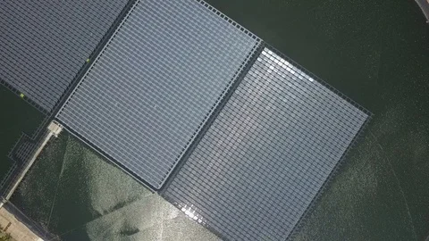 Aerial view of floating Solar Farm or Solar panels on the water in industrial Stock Footage 105992018