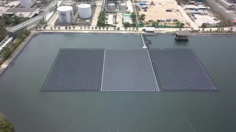 Aerial view of floating Solar Farm or Solar panels on the water in industrial Stock Footage 105992140