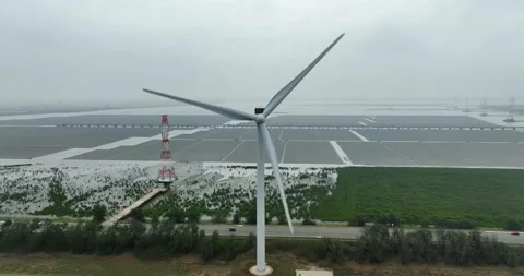Aerial view of Floating solar power plant and wind turbine farm Stock Footage 233718522