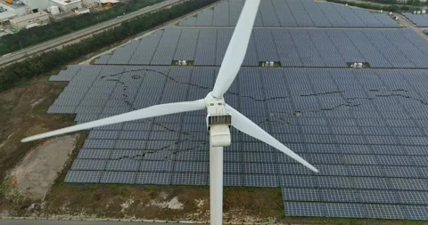 Aerial view of Floating solar power plant and wind turbine farm Stock Footage 233718548