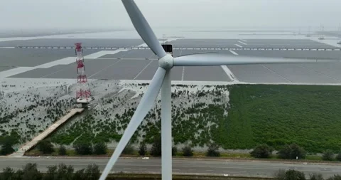 Aerial view of Floating solar power plant and wind turbine farm Stock Footage 233718550