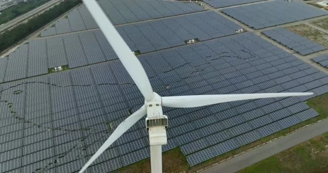 Aerial view of Floating solar power plant and wind turbine farm Stock Footage 233718609