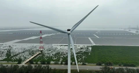 Aerial view of Floating solar power plant and wind turbine farm Stock Footage 233718643