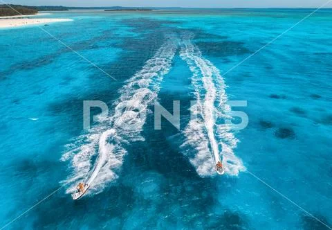 Aerial view of floating water scooter in blue water at sunny day Stock Photos
