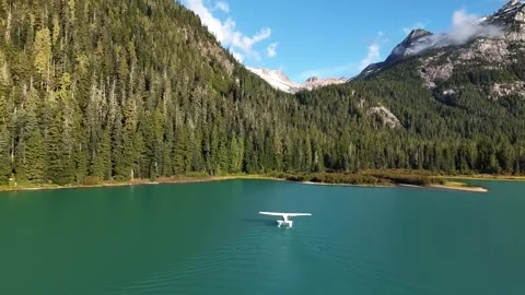 Aerial View of Floatplane on Serene Lake in Sunshine Coast Mountains Stock Footage 342583339