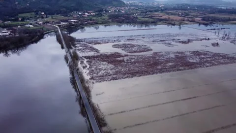 Aerial view of flooded fields and street, swampy area, wide shot Vidéo 147878785