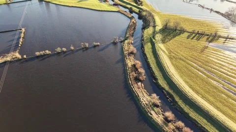 Aerial View of Flooded Fields and Green Patches Video stock 294094027