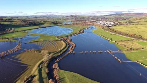 Aerial View of Flooded Fields and Distant Town Video stock 294094111