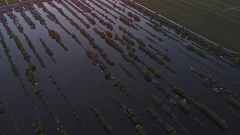 Aerial view of flooded scheendijk polder at sunset in the netherlands Stock Footage 342280776