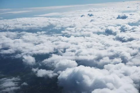 Aerial view fluffy cloud and sky from window of airplane 스톡 사진