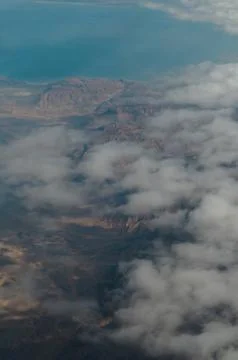 Aerial view fluffy clouds above desert landscape and Suez Gulf in Egypt Stock Photos