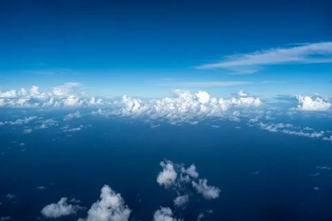 Aerial view of fluffy clouds over the Pacific Ocean in Polynesia Stock Photos