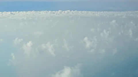 Aerial view of fluffy white clouds, A serene aerial view of a vast expanse of Stock Footage 297274923