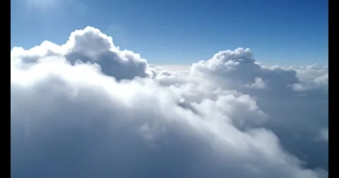 Aerial view of fluffy white clouds against blue sky on transparent background Stock Footage 330397418