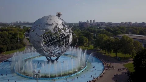 Aerial view of Flushing Meadows Unisphere with clear blue sky Stock Footage