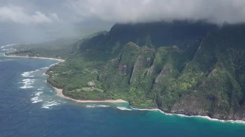 Aerial view of the fluted green cliffs of the Na Pali coast 動画素材 347826128