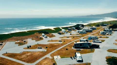 Aerial view fly Camping zone for cars on wheels on the shore of the Pacific Video stock 202577883