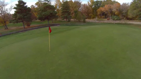 Aerial view fly up of golf course green Stock Footage 32243235