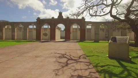 Aerial View Fly Out Thru Arches &amp;  Abandoned Old Maui High School Stock Footage 74223830