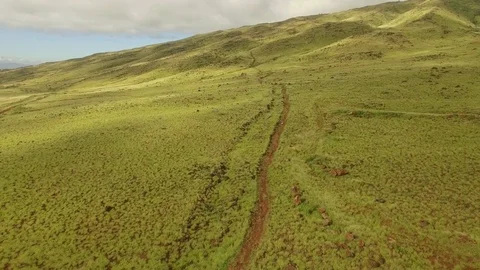 Aerial View Fly Over Dusty Hiking Trail in A Grassy Valley. Stock Footage 72640182